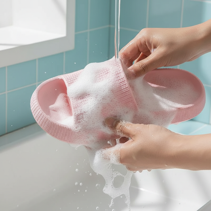 Pink sandal being washed with foam